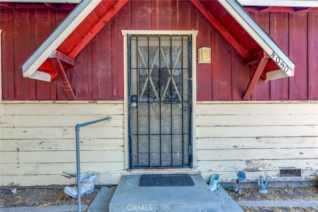 property entrance with board and batten siding