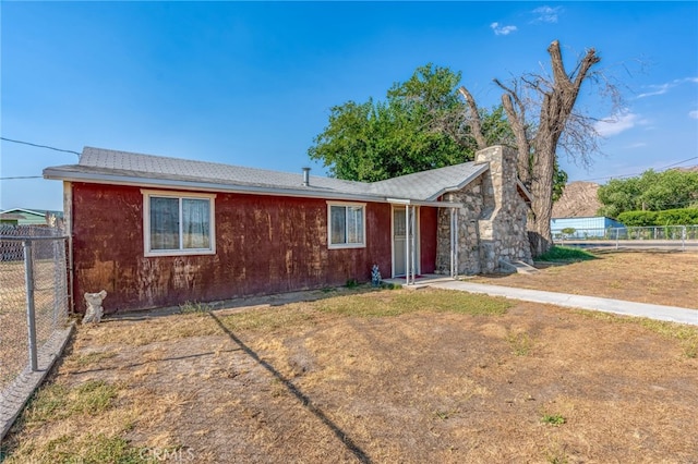 single story home with fence