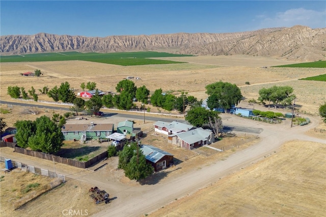 birds eye view of property with a mountain view and a rural view