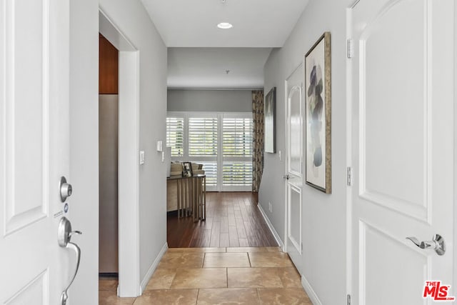 corridor featuring hardwood / wood-style floors