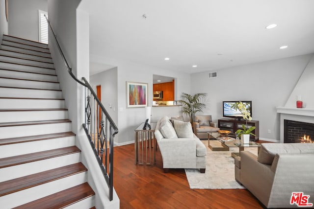 living room with dark hardwood / wood-style floors