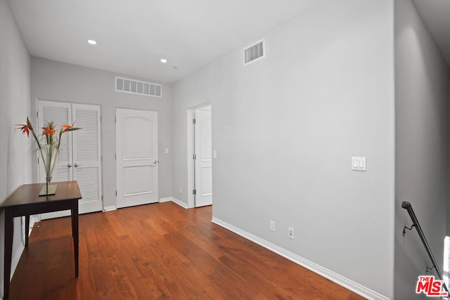 hallway featuring hardwood / wood-style floors