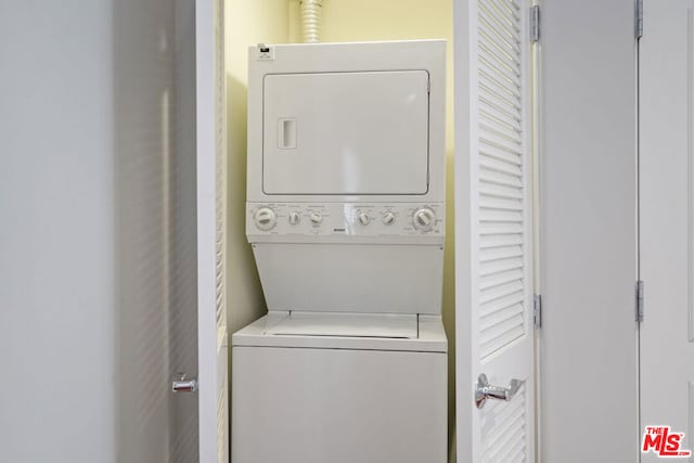 laundry room featuring stacked washer and dryer