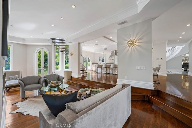 living room featuring crown molding, french doors, and dark hardwood / wood-style flooring