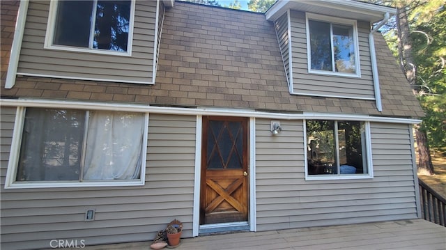 entrance to property with a wooden deck