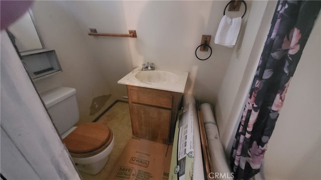 bathroom with vanity, toilet, and a shower with curtain