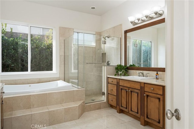 bathroom with vanity, independent shower and bath, and tile patterned flooring