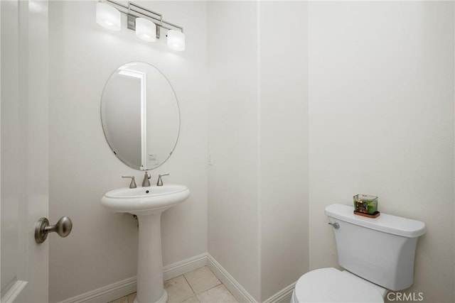 bathroom featuring toilet and tile patterned floors