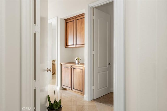 hall with light tile patterned flooring