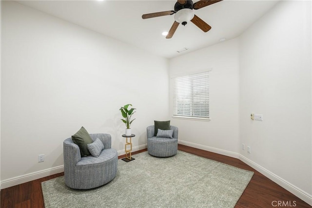 sitting room featuring ceiling fan and wood-type flooring