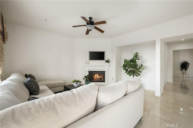 living room with ceiling fan and light tile patterned flooring