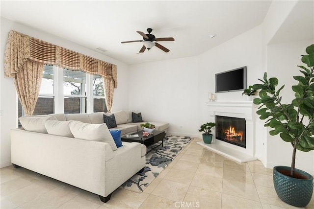 tiled living room featuring ceiling fan