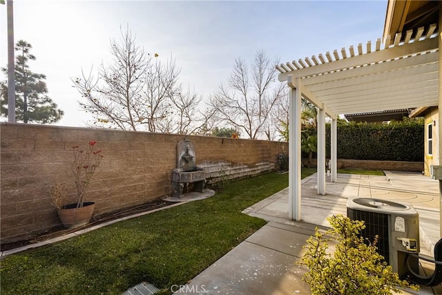 view of yard featuring central AC, a patio, and a pergola