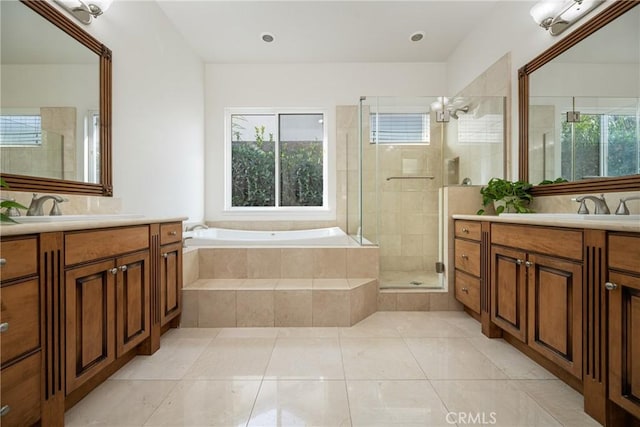 bathroom with separate shower and tub, vanity, tile patterned floors, and a chandelier