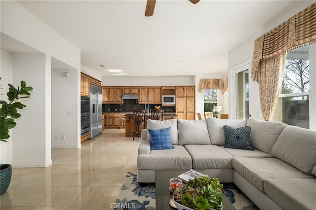 living room with ceiling fan