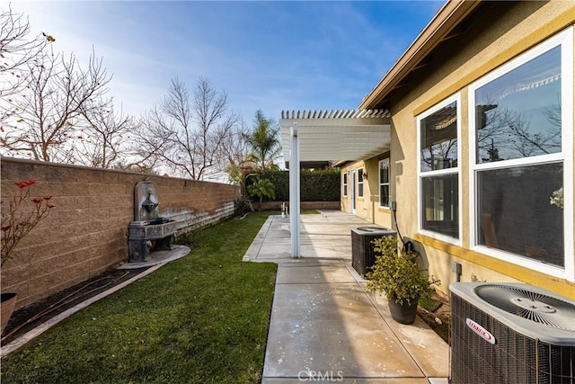 view of yard featuring central AC, a pergola, and a patio area