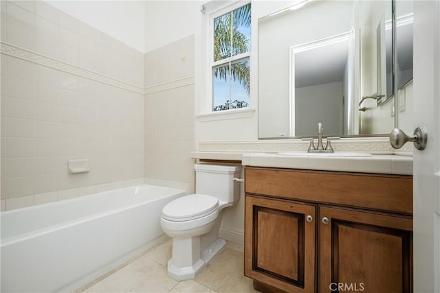 full bathroom featuring toilet, tile patterned flooring, tiled shower / bath combo, and vanity