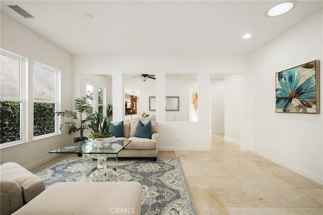 living room featuring ceiling fan