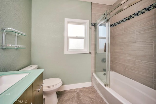 full bathroom with toilet, bath / shower combo with glass door, tile patterned floors, and vanity