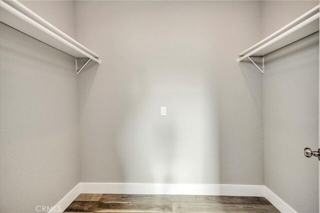 walk in closet featuring hardwood / wood-style floors