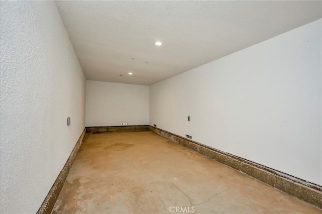 empty room featuring concrete flooring