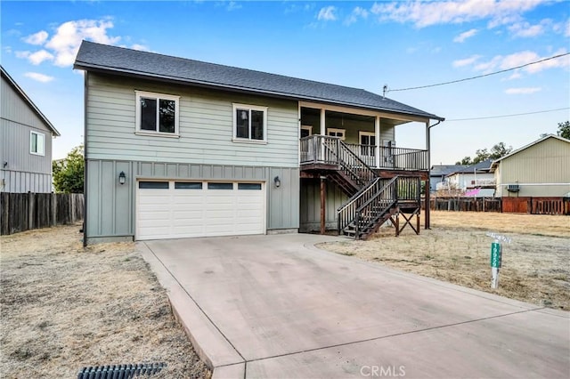 view of front of house with covered porch and a garage