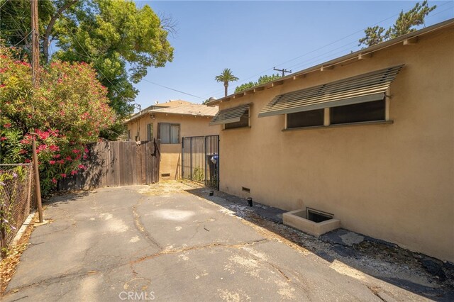 view of property exterior featuring a patio area