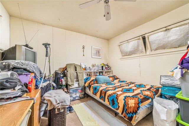 bedroom featuring ceiling fan and carpet flooring