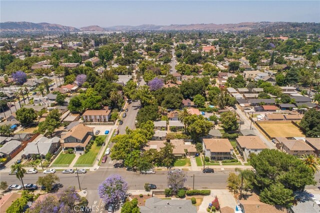 birds eye view of property featuring a mountain view