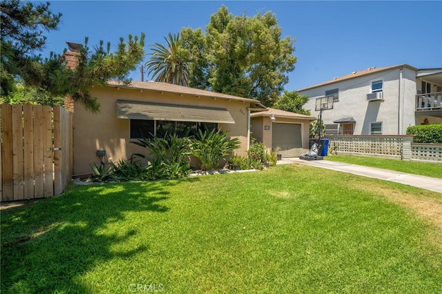 view of front of home featuring a garage and a front lawn