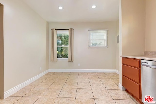 unfurnished room with light tile patterned floors