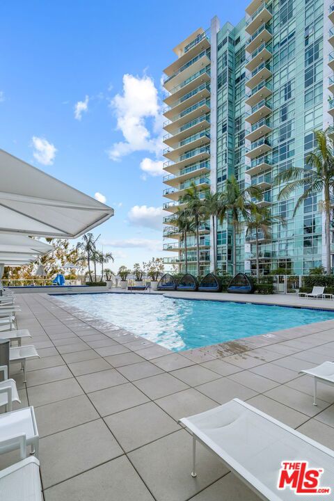 view of swimming pool with a patio