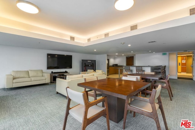 dining area with carpet