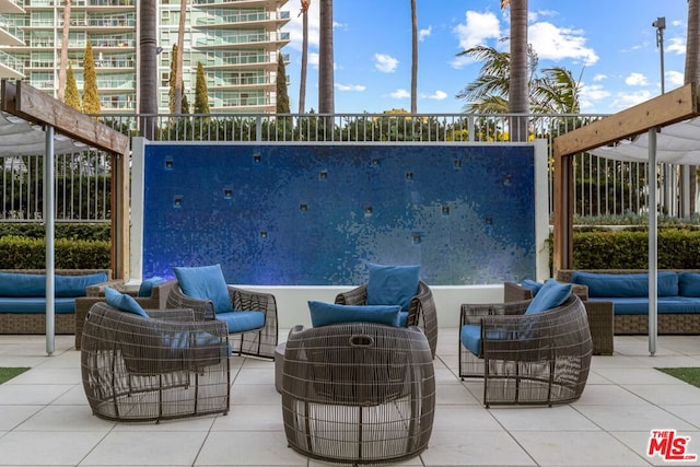 view of patio / terrace with an outdoor living space and a balcony