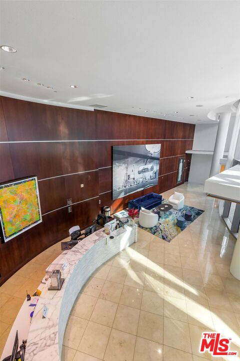 tiled living room with wood walls