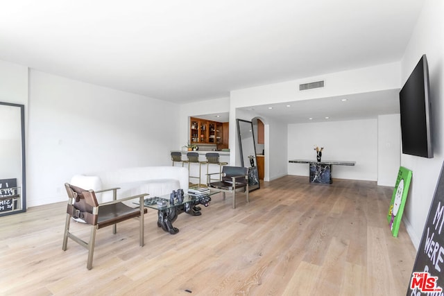 sitting room featuring light hardwood / wood-style floors