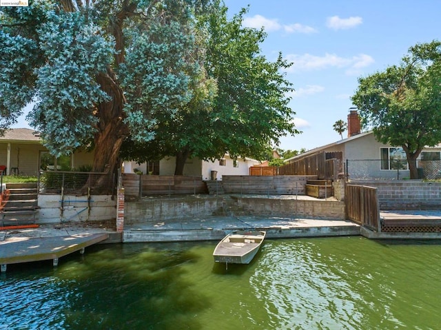 dock area with a water view