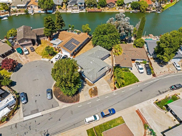 birds eye view of property with a water view