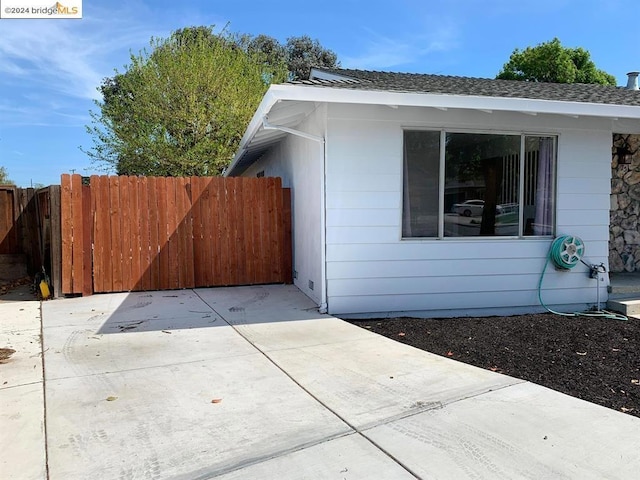 view of property exterior with a patio