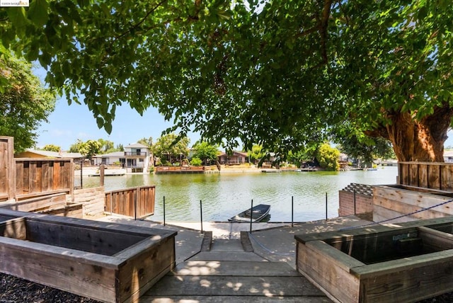 view of dock with a water view