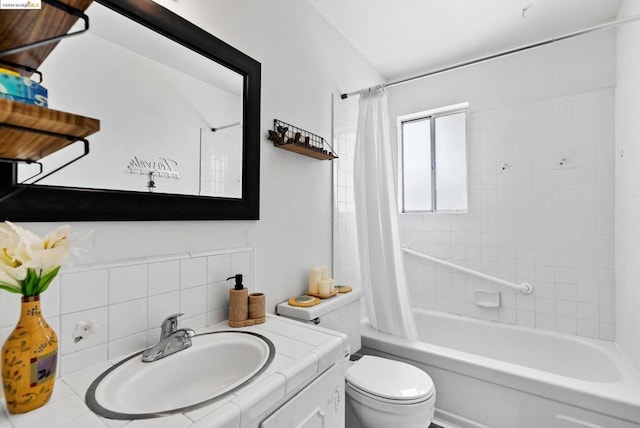 full bathroom with vanity, toilet, tasteful backsplash, and shower / tub combo with curtain