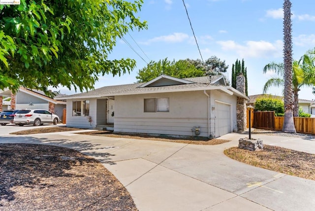 ranch-style house featuring a garage