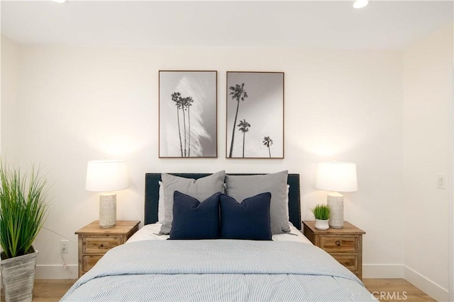 bedroom with light hardwood / wood-style floors