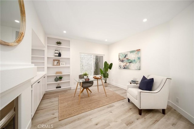 living area with light hardwood / wood-style floors