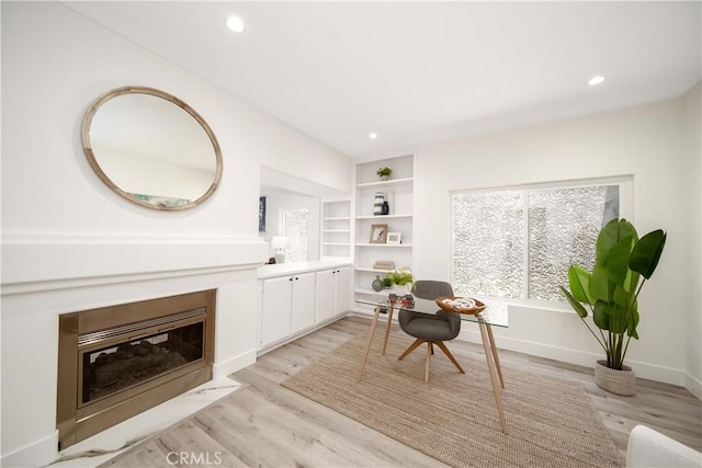 sitting room with light hardwood / wood-style floors