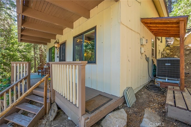 exterior space with central AC unit and a deck