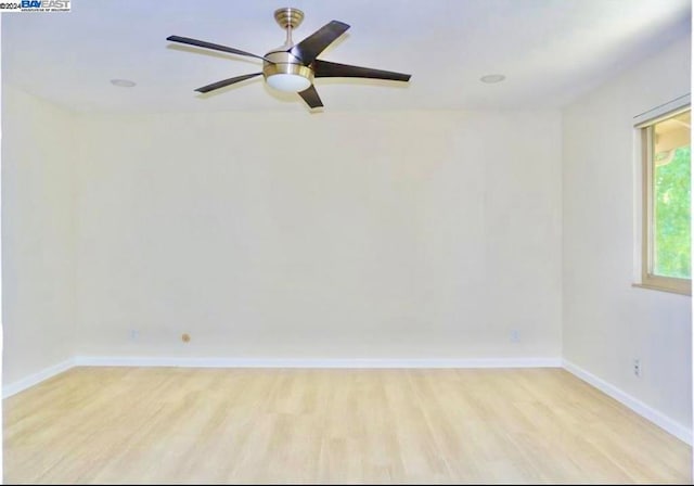 unfurnished room featuring light wood-type flooring and ceiling fan