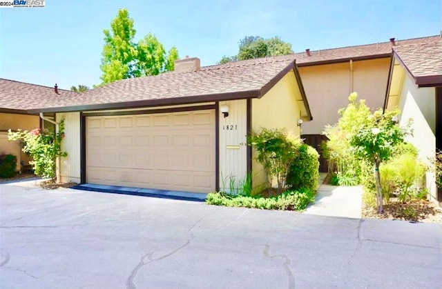 ranch-style house featuring a garage