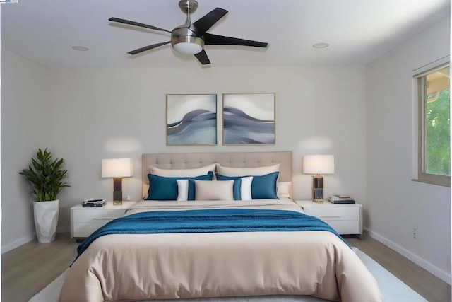 bedroom featuring wood-type flooring and ceiling fan