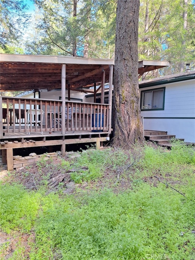 exterior space featuring a wooden deck